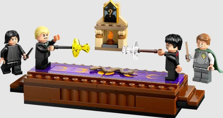Harry Potter and Draco Malfoy duel on the Dueling Club platform with Snape watching.