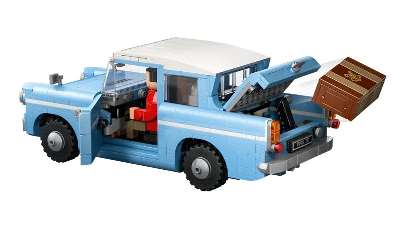LEGO Harry Potter Enchanted Flying Ford Anglia with rear boot open, brown luggage ejected from the boot, side door open, and character figures visible inside on a white background
