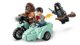 Close up of LEGO Hagrid and Harry Potter minifigures riding the flying motorcycle with sidecar while a Death Eater minifigure flies behind holding a broom