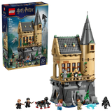 LEGO Harry Potter Hogwarts Castle Hospital Wing 76463 box shown beside the assembled tan tower build on a grey rocky base with minifigures, black spider and blue wolf figure