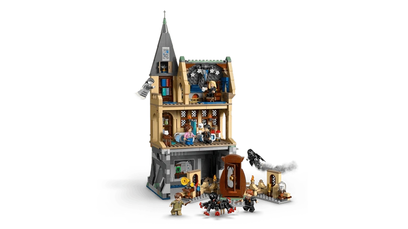 Rear view of LEGO Hogwarts Castle Hospital Wing 76463 opened to show interior rooms including hospital beds, classroom space, bookcases and minifigures with accessories
