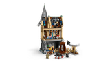 Rear view of LEGO Hogwarts Castle Hospital Wing 76463 opened to show interior rooms including hospital beds, classroom space, bookcases and minifigures with accessories