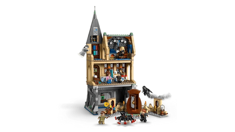 Rear view of LEGO Hogwarts Castle Hospital Wing 76463 opened to show interior rooms including hospital beds, classroom space, bookcases and minifigures with accessories