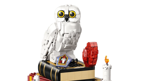 LEGO Hedwig owl build on a book with red stone, candle and framed card details
