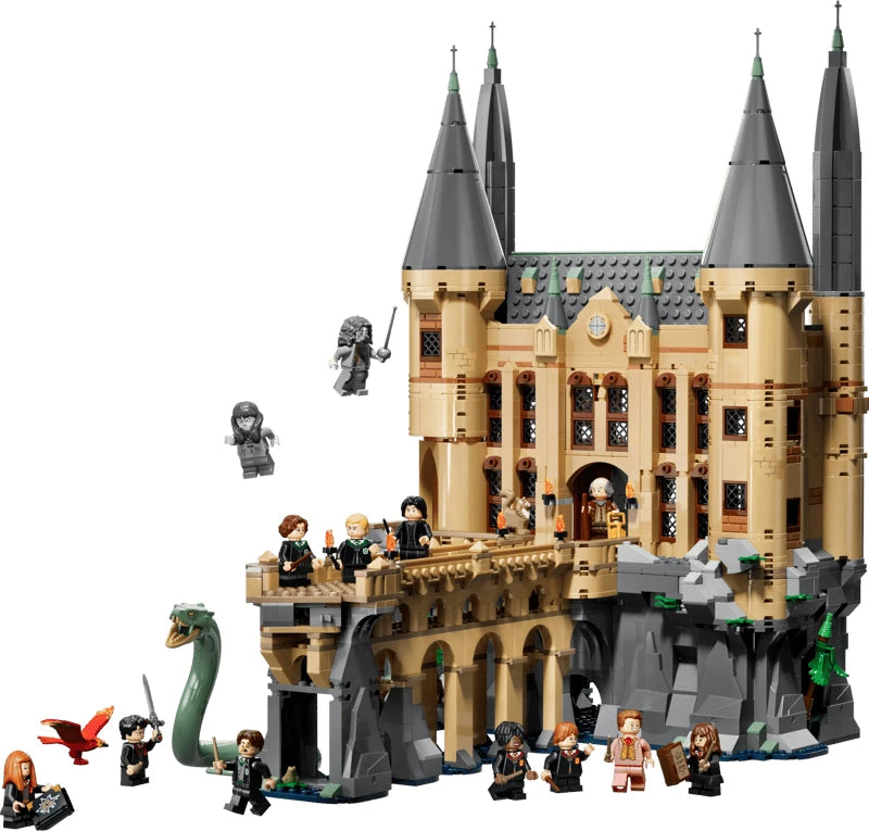 LEGO Hogwarts Castle East Wing model with castle towers, bridge, minifigures, green snake figure, red bird figure and blue Patronus figure