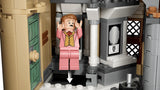 LEGO Hogwarts bathroom section with pink minifigure, green door, grey pillars and downward arrow marker