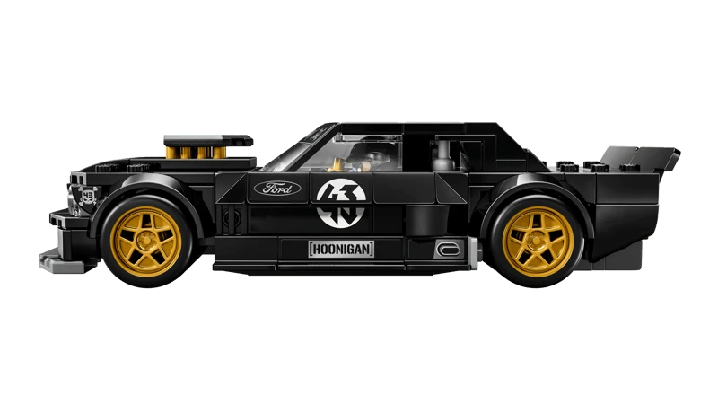 Side view of LEGO black Hoonicorn car model with gold wheels and side graphics