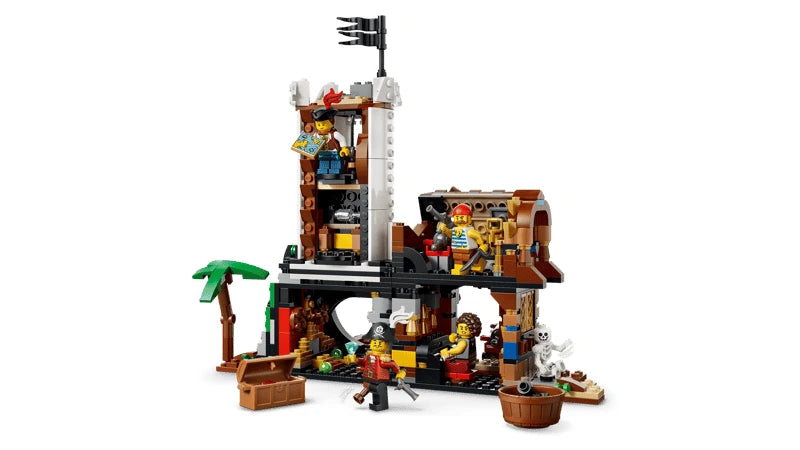 Open LEGO pirate castle build with tower, palm tree, treasure chest and pirate minifigures