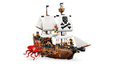 Side view of LEGO pirate ship with white sails, red sea monster, cannon and pirate minifigures