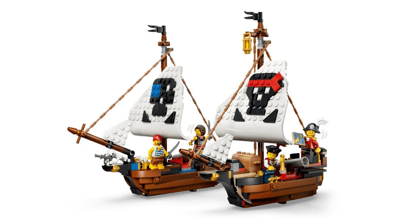 Two small LEGO pirate ships with white sails, pirate minifigures and cannons