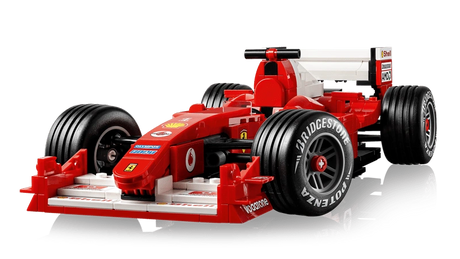 LEGO Icons Ferrari F2004 completed model close-up showing red bodywork, Bridgestone Potenza tyres and white rear wing