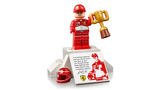 LEGO Icons Michael Schumacher minifigure in red racing suit holding trophy on podium display stand with printed quote