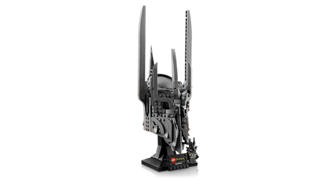 Angled side view of LEGO Icons Sauron’s Helmet model on black display stand with Sauron minifigure holding a gold ring