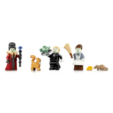 Three LEGO minifigures with a black post, broom, orange cat, yellow cheese piece and brown rat