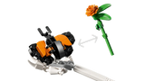 Close-up of the LEGO Ideas La Catrina 21372 orange butterfly and flower accessories with arrows between them