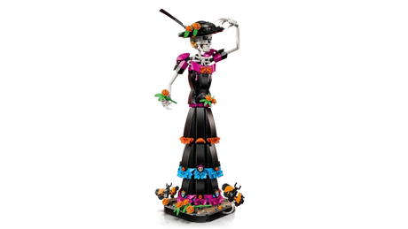 LEGO Ideas La Catrina 21372 figure touching the decorated hat while holding an orange flower