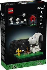 Rear of the LEGO Ideas Peanuts Snoopy's Doghouse box showing a campfire scene with Snoopy and Woodstock, plus diagrams of the figure poses and removable doghouse.