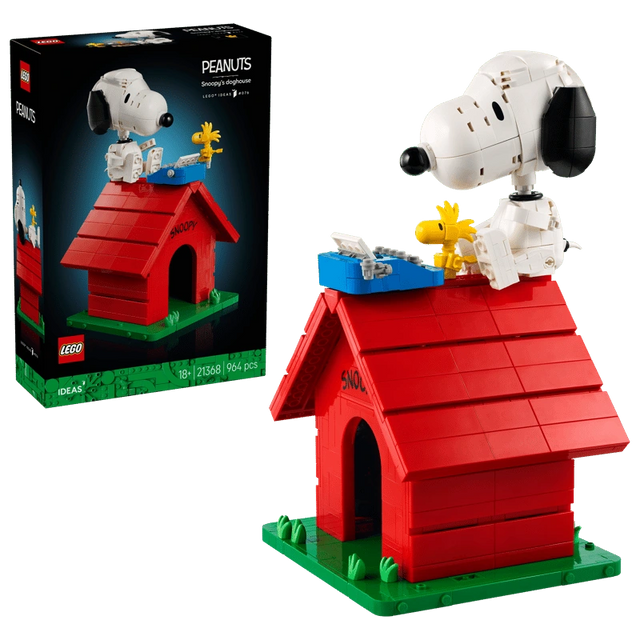 LEGO Ideas Peanuts Snoopy's Doghouse 21368 retail box beside the completed red doghouse, with Snoopy, Woodstock and a blue typewriter on the roof.