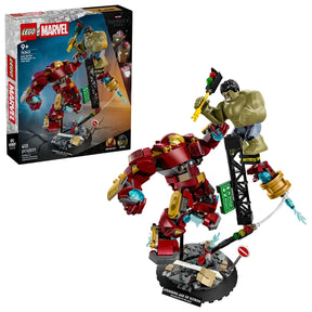 LEGO Marvel Epic Battle Hulkbuster vs The Hulk set showing retail box beside the assembled Hulkbuster mech and Hulk figure on a street display base

