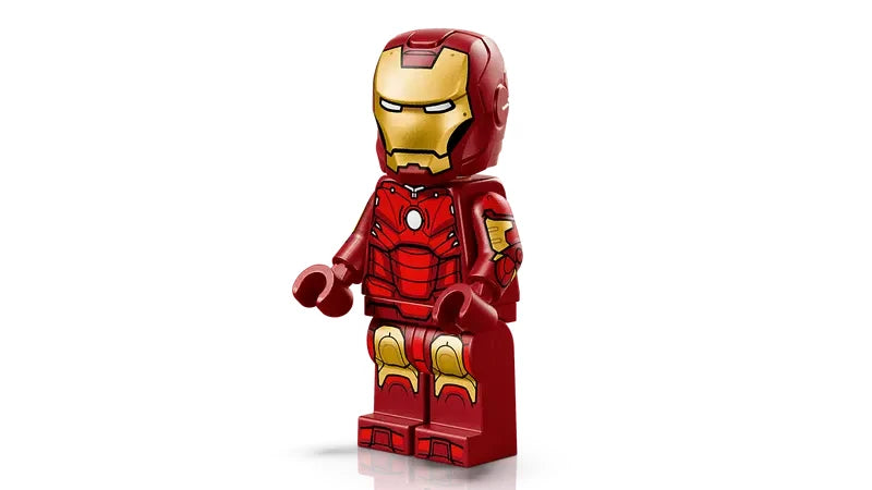 Iron Man minifigure in red and gold Mark 3 armour with a circular blue Arc Reactor