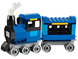 LEGO Medium Creative Brick Box 10696 blue locomotive and passenger carriage built with blue, black, white and grey LEGO bricks.