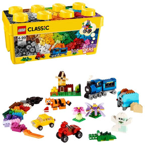 LEGO Medium Creative Brick Box 10696 yellow storage container displayed with colourful bricks and completed train, car, tiger, flower and animal models.
