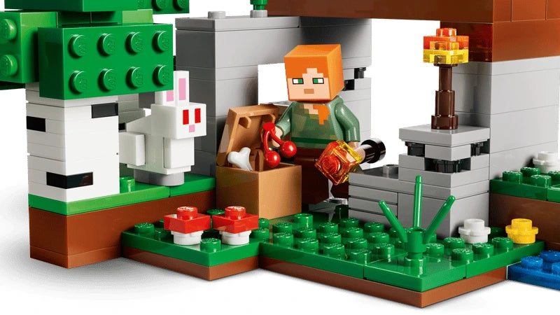 LEGO Minecraft Alex figure beside a chest, rabbit, torch and birch tree
