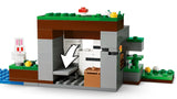 LEGO Minecraft shelter build with white arrow, rabbit figure and chest