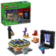LEGO Minecraft box shown next to the assembled LEGO set, including a black rectangular portal build, a tan and green platform, three LEGO figures, a small orange animal figure, a purple pillar piece and a red block