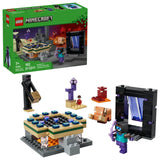 LEGO Minecraft box shown next to the assembled LEGO set, including a black rectangular portal build, a tan and green platform, three LEGO figures, a small orange animal figure, a purple pillar piece and a red block