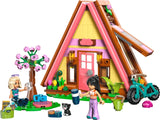 LEGO Friends A-frame cabin build with two mini-dolls, kitten, garden details and bike
