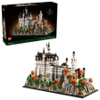 LEGO Neuschwanstein Castle 21063 box shown above the completed castle model with landscaped base, pine trees and orange autumn trees on a black background