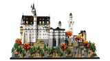 LEGO Neuschwanstein Castle 21063 side view showing the castle walls, towers, rocky hillside base, pine trees and orange autumn trees