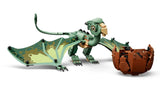 Green LEGO baby dragon standing beside an opened brown egg
