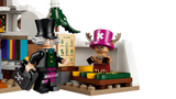 LEGO One Piece Dr. Hiriluk and Tony Tony Chopper minifigures beside the bed, books and plant chart