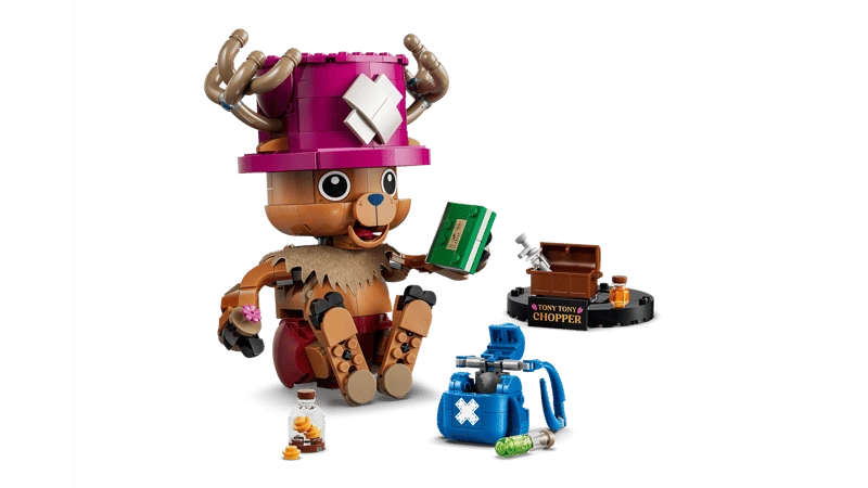 LEGO One Piece Tony Tony Chopper 75643 figure seated beside a green book, bottles, blue backpack and display stand