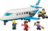 LEGO Passenger Jet with four minifigures and luggage cart on a white background
