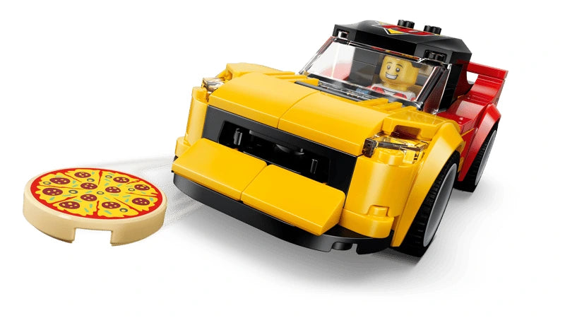 Yellow and red LEGO sports car beside a round pizza piece