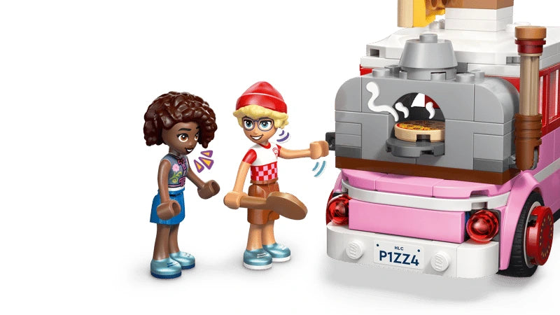 LEGO Friends mini-dolls beside the pizza truck oven with pizza and front counter visible