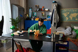 Person adjusting the LEGO Pokémon Arcanine 72160 model on a desk