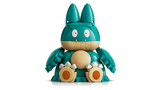 Front view of the LEGO Pokémon Munchlax 72150 figure seated with its arms beside its body