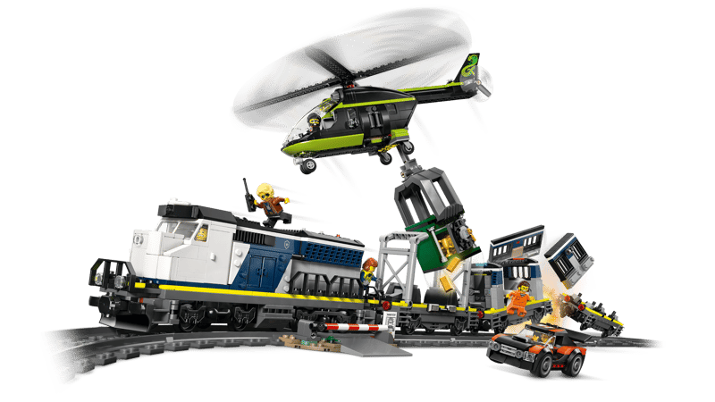 LEGO Police Train Heist action scene with helicopter lifting the safe from the train as the rally car drives beside the track
