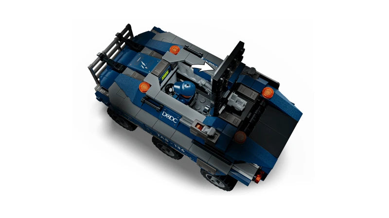 Top view of a LEGO blue prison transport vehicle with roof panels opened