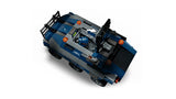 Top view of a LEGO blue prison transport vehicle with roof panels opened