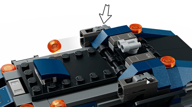 Close-up of a LEGO blue prison transport roof section with grey launcher pieces and an arrow marker