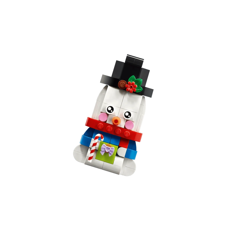 LEGO snowman ornament in a black top hat and red scarf holding a candy cane and green gift