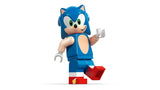 LEGO Sonic minifigure standing alone with raised hand, blue body, tan chest detail and red shoes on a white background