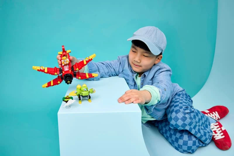 Child playing with the LEGO Sonic the Hedgehog Tails' Tornado-1 77119 biplane and Egg Chaser figure