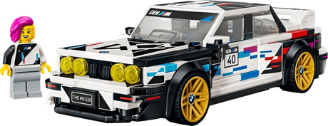 Front three quarter view of the LEGO Speed Champions BMW M3 (E30) 77263 with gold wheels and the BMW driver minifigure