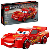 LEGO Speed Champions Lightning McQueen model car with retail box shown together, front view of red car with printed headlights and number 95 graphics